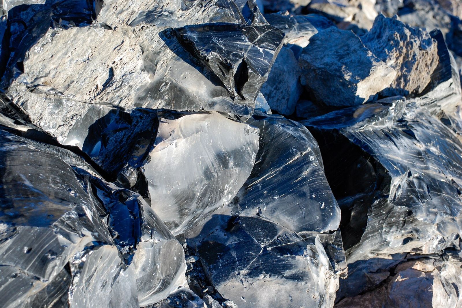 Glassy black obsidian boulders on the Big Obsidian Flow