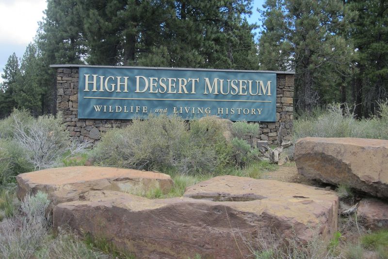 High Desert Museum entrance sign among sagebrush and pines
