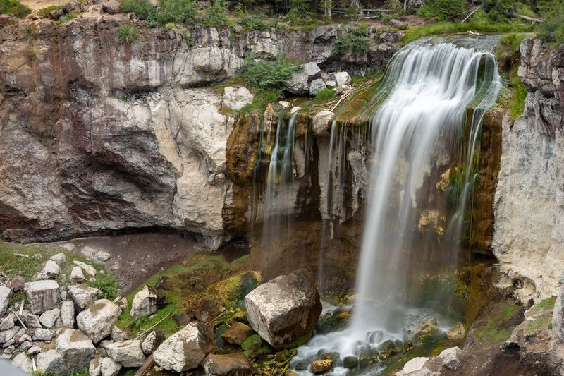 Paulina Falls spilling over pale volcanic cliffs in Newberry National Volcanic Monument